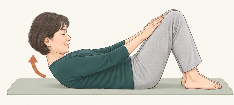 おへそをのぞき込むように、頭と肩を持ち上げる
